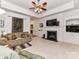 Living room with a fireplace, built-in cabinets, and a comfortable seating area for relaxing at 147 Wren Hill Dr, Mooresville, NC 28115