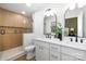 Spa-like bathroom boasting a dual vanity, modern fixtures, and a separate shower with wood-look paneling at 1490 White Hall Pl, Gastonia, NC 28056