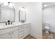 Modern bathroom with dual sinks, sleek black fixtures, and bright lighting for a luxurious feel at 1490 White Hall Pl, Gastonia, NC 28056