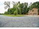 View of the house and garage from the driveway at 15025 Barbee Rd, Stanfield, NC 28163