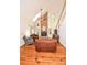 Inviting living room with a brick fireplace, hardwood floors, and vaulted ceilings at 15025 Barbee Rd, Stanfield, NC 28163