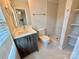 Well-lit bathroom with a modern vanity and a tiled walk-in shower at 1519 Briar Creek Rd # B, Charlotte, NC 28205