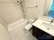 Modern bathroom with a shower-over-tub combination and sleek, updated vanity at 1519 Briar Creek Rd # B, Charlotte, NC 28205