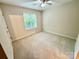 Cozy bedroom featuring carpet flooring, a ceiling fan, and natural light from the window at 1519 Briar Creek Rd # B, Charlotte, NC 28205
