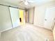 Bedroom featuring a sliding barn door to the bathroom, carpet flooring, neutral paint, and ample natural light at 1519 Briar Creek Rd # B, Charlotte, NC 28205