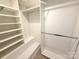 Spacious walk-in closet with custom shelving and ample hanging space at 1519 Briar Creek Rd # B, Charlotte, NC 28205