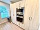 Kitchen with stainless steel appliances, modern cabinets and sink, and a convenient washer and dryer at 1519 Briar Creek Rd # B, Charlotte, NC 28205