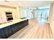 Open-concept kitchen and living room features natural light, modern appliances, and access to the outdoors at 1519 Briar Creek Rd # B, Charlotte, NC 28205