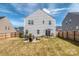 Spacious backyard featuring a patio, fire pit, and plenty of room for activities at 1607 Tundra Ln, Denver, NC 28037
