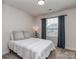Cozy bedroom with a comfy bed, soft carpet, and natural light from the window at 1607 Tundra Ln, Denver, NC 28037