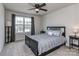 Comfortable bedroom featuring a ceiling fan and natural light from the window at 1607 Tundra Ln, Denver, NC 28037