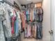 Organized walk-in closet with multiple shelves, rods, and ample storage space for clothes and accessories at 1607 Tundra Ln, Denver, NC 28037