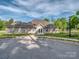 Attractive building exterior with well-maintained landscaping and ample parking at 1607 Tundra Ln, Denver, NC 28037