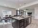 Open kitchen seamlessly connects to a dining area, complete with granite countertops at 1607 Tundra Ln, Denver, NC 28037