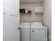Functional laundry room with washer and dryer, and overhead shelving for storage at 1607 Tundra Ln, Denver, NC 28037