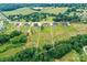 Drone view of property's surrounding landscape and neighboring homes in a serene setting at 181 Lone Pine Rd, Statesville, NC 28625