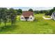 Aerial view of a charming home with a lush green lawn at 181 Lone Pine Rd, Statesville, NC 28625