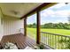 Inviting covered back porch providing stunning views of the lush green lawn and surrounding trees at 181 Lone Pine Rd, Statesville, NC 28625