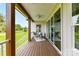 Relaxing covered back porch with a view of the expansive backyard, perfect for outdoor living at 181 Lone Pine Rd, Statesville, NC 28625
