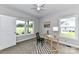 Bright, carpeted bedroom with natural light and a view of the outdoors from two large windows at 181 Lone Pine Rd, Statesville, NC 28625