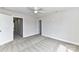 Spacious bedroom with neutral carpet, ceiling fan, and doors to other rooms at 181 Lone Pine Rd, Statesville, NC 28625