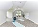 Spacious bonus room featuring neutral walls, plush carpeting, and natural light, perfect for fitness or relaxation at 181 Lone Pine Rd, Statesville, NC 28625