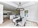 Cozy dining room features a modern chandelier and views to the kitchen and living areas at 181 Lone Pine Rd, Statesville, NC 28625