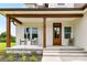 Inviting front porch with stylish seating, complemented by a well-maintained garden and elegant entrance at 181 Lone Pine Rd, Statesville, NC 28625