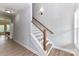Hallway with stairs, hardwood floors and light colored walls at 181 Lone Pine Rd, Statesville, NC 28625
