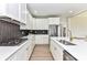 Bright kitchen with white cabinetry, stone countertops, stainless steel appliances, and gas range at 181 Lone Pine Rd, Statesville, NC 28625