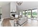 Bright living room with a floor-to-ceiling fireplace, comfortable seating, and a sliding glass door to the outside at 181 Lone Pine Rd, Statesville, NC 28625