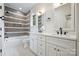 Stylish bathroom featuring double sink vanity, white cabinets, and shower-tub combination at 1834 Arnold Dr, Charlotte, NC 28205
