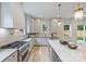 Modern kitchen with stainless steel appliances, sleek countertops, and ample cabinet space at 1834 Arnold Dr, Charlotte, NC 28205