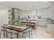 Bright, open kitchen with a large island, modern appliances, and a stylish dining area at 1834 Arnold Dr, Charlotte, NC 28205