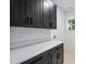 Laundry room with sleek cabinets, counter space, and a window for natural light at 1834 Arnold Dr, Charlotte, NC 28205