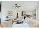 Open living room with stylish decor, modern lighting, and seamless flow into the kitchen at 1834 Arnold Dr, Charlotte, NC 28205