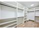 Spacious walk-in closet with custom shelving and hardwood floors at 1834 Arnold Dr, Charlotte, NC 28205