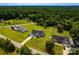 Aerial view of homes with long driveways on expansive green and wooded lots at 1858 Brevard Place Rd, Iron Station, NC 28080