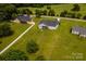 Aerial view of neighborhood featuring well-maintained yards and neighboring homes at 1858 Brevard Place Rd, Iron Station, NC 28080