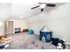 Bonus room with neutral paint, carpet, toys, play tent, and storage at 1858 Brevard Place Rd, Iron Station, NC 28080