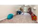 Bonus room with carpet, toys, a play tent, and plenty of space for activities at 1858 Brevard Place Rd, Iron Station, NC 28080