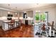 Bright kitchen with an eat-in dining area, stainless steel appliances and access to a deck at 1858 Brevard Place Rd, Iron Station, NC 28080