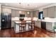 Modern kitchen with stainless steel appliances, granite countertops, and a center island with seating at 1858 Brevard Place Rd, Iron Station, NC 28080