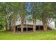 Inviting backyard featuring a raised deck, mature trees, and lush lawn at 1983 Burkin Rd, McConnells, SC 29726