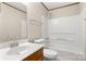Clean bathroom featuring a tub and shower combo, a sleek vanity, and neutral wall color at 1983 Burkin Rd, McConnells, SC 29726