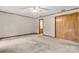 This bedroom features neutral carpeting, a ceiling fan, and a large closet at 1983 Burkin Rd, McConnells, SC 29726