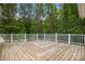 Spacious wooden deck with white railings, offering a great outdoor living space at 1983 Burkin Rd, McConnells, SC 29726