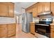 This kitchen features wooden cabinets and stainless steel appliances at 1983 Burkin Rd, McConnells, SC 29726