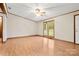 The large living room has hardwood flooring and a window overlooking the front yard at 1983 Burkin Rd, McConnells, SC 29726