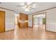 An open floor plan includes hardwood flooring and flows into the kitchen at 1983 Burkin Rd, McConnells, SC 29726